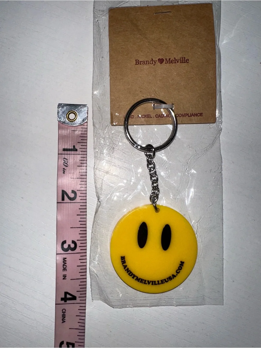 Brandy Melville Smiley Face Keychain